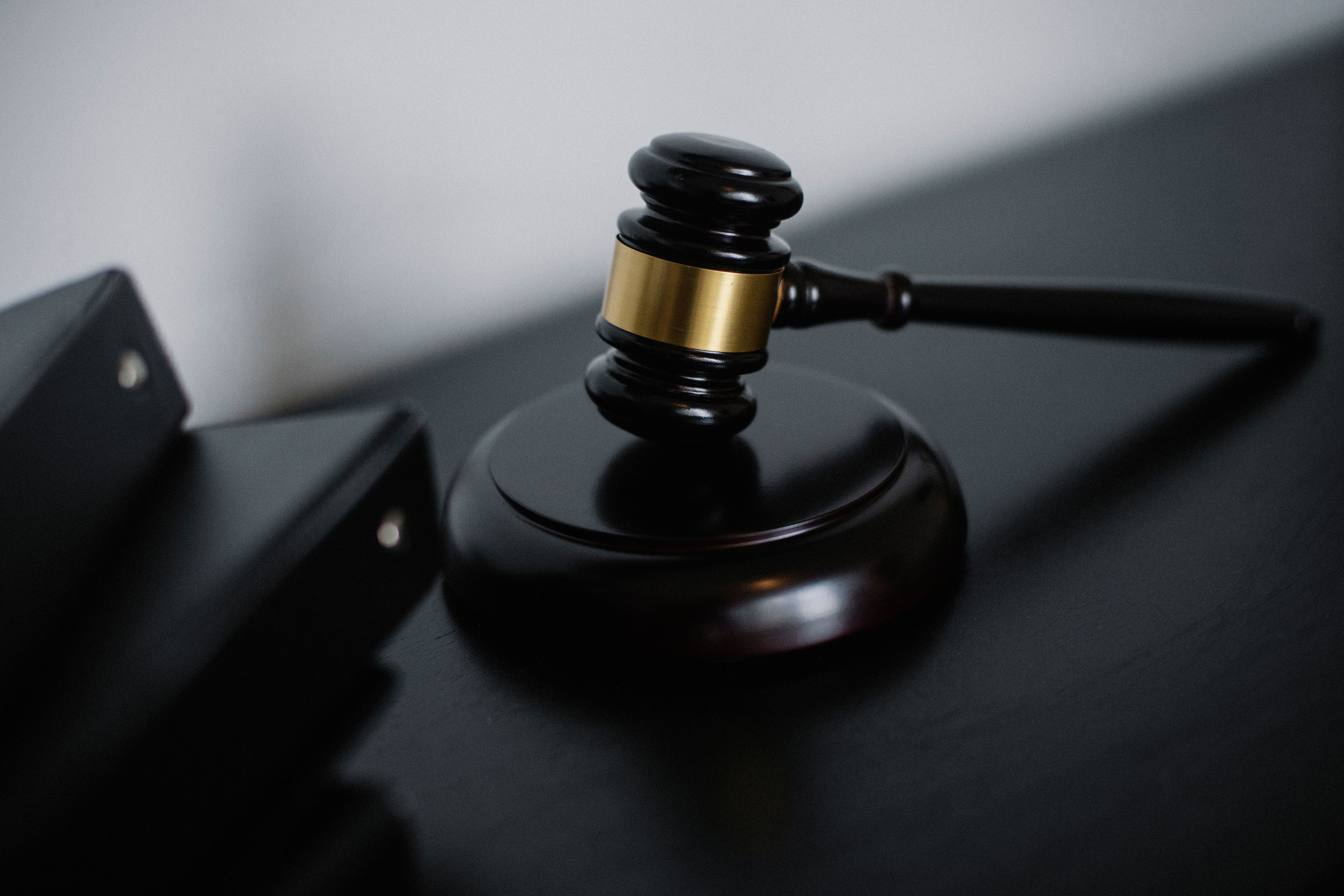 Judge's gavel and files on a desk in a UK court dealing with group litigation
