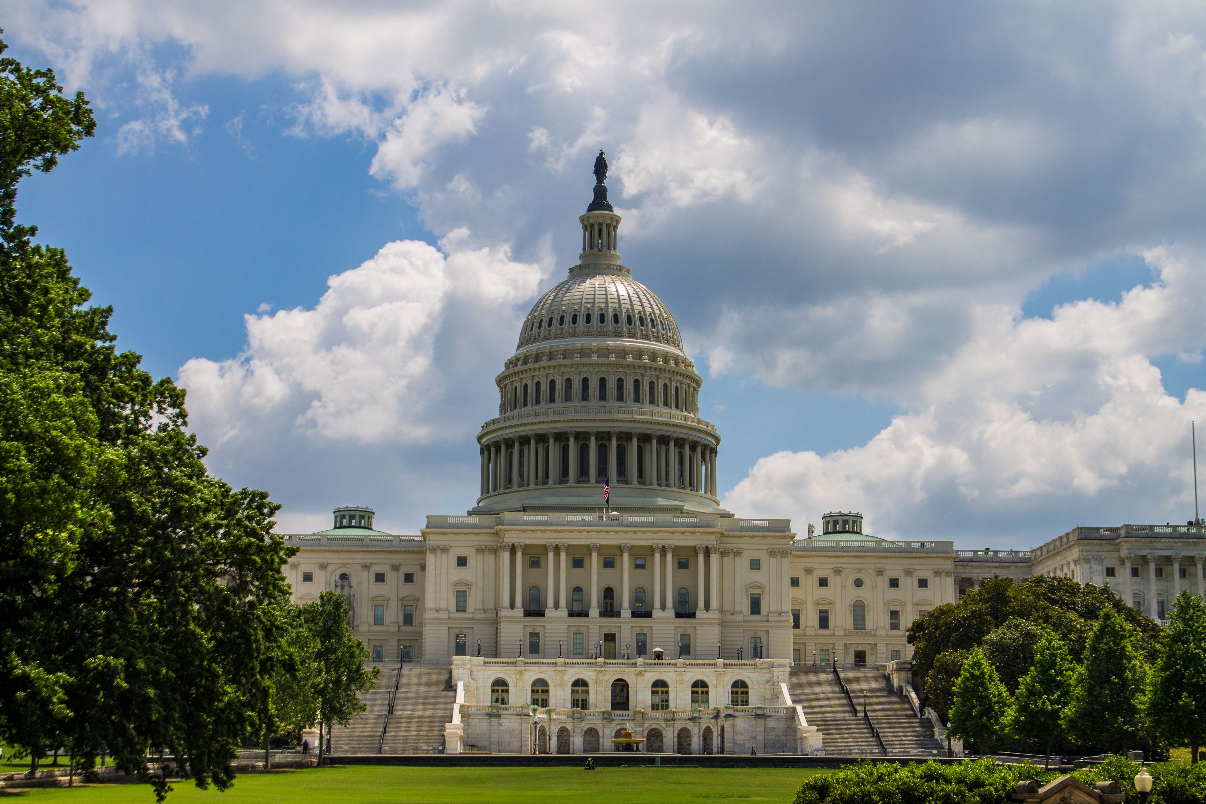 United States Capitol building under a blue sky representing political power and government